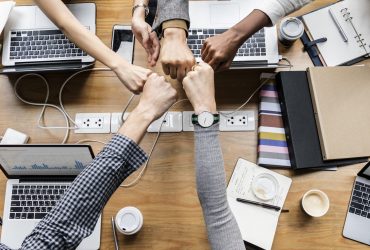 Colleagues giving a fist bump